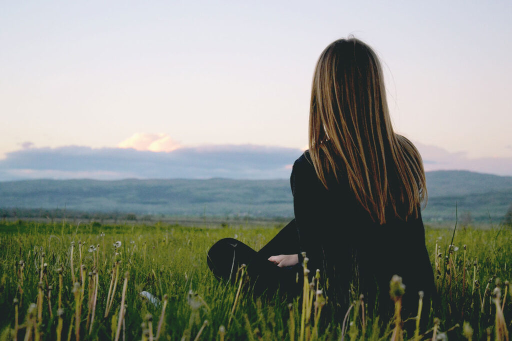 Woman Looking Over Field