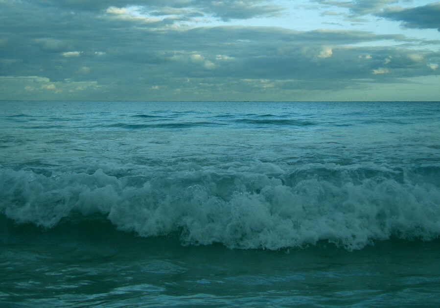 Waves crashing on the beach in the evening Waves crashing on the beach in the evening
